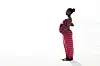 black woman in pink dress pregeant