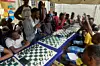 A photo of Tunde Onakoya addressing children during a chess class at Ogolonto in Ikorodu district of Lagos on August 17, 2019.
