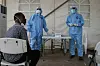 Staff members of the Ministry of Health prepare to take samples for testing for the COVID-19 coronavirus at the testing unit at the Bouffard hospital in Djibouti.