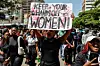 Activists chant slogans and hold placards as they take part in a march against femicide and gender-based violence in Nairobi, on December 10, 2024.