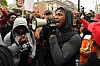 John Boyega at protest with megaphone.