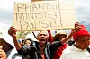 ​Residents protest against the government over illegal miners trapped underground in Khuma on November 16, 2024 in Stilfontein, South Africa.