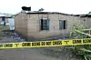This photo taken on June 18, 2023 shows a tap cordoning off the burnt students' dormitory inside the Lhubiriha Secondary School, in Mpondwe, Uganda. Calm has returned to Mpondwe town in Uganda's southwestern district of Kasese, where the Allied Democratic Forces ADF rebels killed 41 people, most of them students, a government official said Sunday.