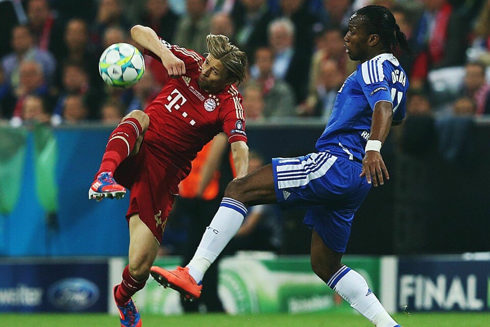 Didier Drogba of Chelsea vies with Anatoliy Tymoshchuk of Bayern Muenchen during UEFA Champions League Final between FC Bayern Muenchen and Chelsea at the Fussball Arena München on May 19, 2012 in Munich, Germany. Didier Drogba of Chelsea vies with Anatoliy Tymoshchuk of Bayern Muenchen during UEFA Champions League Final between FC Bayern Muenchen and Chelsea at the Fussball Arena M\u00fcnchen on May 19, 2012 in Munich, Germany.