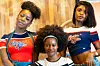 Three young ladies pose in Liberia’s leading streetwear brand - Too Easy