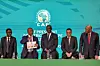 Patrice Motsepe (2nd-L), president of the Confederation of African Football (CAF), announces the host countries for the 2027 Africa Cup of Nations during a ceremony held in Cairo on September 27, 2023. The 2027 Africa Cup of Nations will be jointly hosted by Kenya, Uganda and Tanzania, while Morocco will host the 2025 edition, the Confederation of African Football announced.