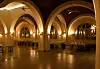 The dining hall at Health and Hope Oasis is a simple room with arched ceilings and traditional Egyptian wall lamps.