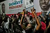 Supporters gather outside anti-establishment candidate Bassirou Diomaye Faye's headquarters in Dakar on March 24, 2024, after voting closed in the presidential election.
