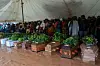 Mourners stand behind coffins of their relatives during a mass funeral for mudslide victims at Chilobwe townships Naotcha Primary school camp in Blantyre, Malawi, on March 15, 2023
