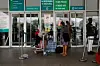 Passengers react while stranded at the gate of the Nnamdi Azikiwe International Airport after the Nigerian unions began an indefinite strike in Abuja, on June 3, 2024.
