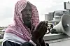 Imam Usman Kald leads the Kara Muslim community during the Eid Al-Adha (Feast of Sacrifice) prayers at Kara Isheri in Ogun State, southwest Nigeria on August 11, 2019. - Muslims across the world are celebrating the annual festival of Eid al-Adha, or the Festival of Sacrifice, which follows the annual pilgrimage to Mecca. It commemorates the willingness of biblical patriarch Abraham to sacrifice his son Ishmael and during the period Muslims distribute food to the poor.