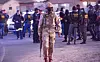 Man in army fatigues and South African police during the coronavirus lockdown.