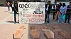 Afro-Colombian, Black, Raizal, and Palenquero civil-rights activists use mock coffins and statistics to protest erasure of Afro-descendants