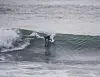 A surfer riding a wave