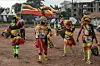 A group of Ugandan football superfans decked out in the country’s colors