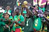 An image of Senegal captain Kalidou Koulibaly holding the AFCON trophy as his team celebrate winning the tournament in 2022.