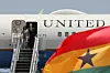 US Vice President Kamala Harris (L) and Second Gentleman of the United States Douglas Emhoff (L) disembarks the plane as they arrive at the Kotoka International Airport in Accra, Ghana.