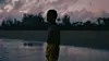An image from the film, 'Baba,' of a small boy looking at a lake.