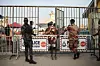 Ghana police officers look on as voters leave a polling station in Accra on December 7, 2024, during the Ghana presidential and parliamentary elections.