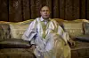 A photo of Mauritanian President Mohamed Ould Ghazouani poses for a portrait while sitting on a chair.