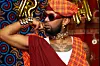 Litchi Hov poses wearing a colourful garment