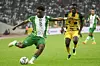 Nigeria's Ola Aina kicks the ball as Ghana's Felix Afena-Gyan looks on during the World Cup 2022 qualifying football match between Nigeria and Ghana at the National Stadium in Abuja on March 29, 2022.