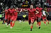 Equatorial Guinea's players celebrate after winning the Africa Cup of Nations (CAN) 2021 round of 16 football match between Mali and Equatorial Guinea at Limbe Omnisport Stadium in Limbe on January 26, 2022.