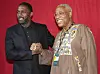 An image of Pan African Film Festival co-founder Ayuko Babu with actor Idris Elba