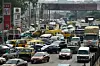 Drivers wait in line to buy fuel at and next to a filling station, causing traffic gridlock on Lagos' Ibadan expressway, in Lagos on January 30, 2023.