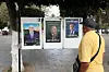 People walk past election posters ahead of the presidential election in Algiers, Algeria, on August 25, 2024.