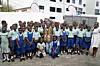 A photo of James Barnor and schoolchildren after the durbar at e - Ananse, Accra, June 7 2024