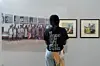 A young woman looks at James Barnor\u2019s work at the opening of \u2018James Barnor : On the Road\u2019 exhibition at Savannah Center for Contemporary Art, Tamale, June 2 2024.