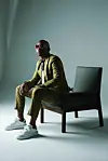 South African rapper Khuli Chana stylishly rocking a lime suit