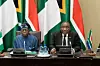 South African President Cyril Ramaphosa (R) addresses the 11th Session of the Bi-National Commission between South Africa and Nigeria, with Nigerian President Bola Tinubu (L) at the South African Parliament in Cape Town on December 3, 2024.