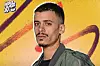 Portrait of Libyan rapper Ka7hla in front of a yellow background, promoting Benghazi Summer Festival.