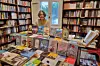 Karam Youssef is in her bookstore, surrounded by books that she has published.