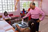 Former Prime Minister of Mauritius and candidate for Alliance du Changement, Navin Ramgoolam (R), casts his ballot during the 2024 Mauritian general election at a polling station in Port Louis on November 10, 2024.