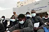 Illegal migrants from Niger wait during a deportation operation in the Libyan capital Tripoli on December 25, 2024.