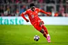 Alphonso Davies of FC Bayern Munchen dribbles with the ball during the UEFA Champions League Quarterfinal Second Leg match between FC Bayern Munchen and Manchester City at the Allianz Arena on April 19, 2023 in Munich, Germany