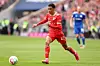 Jamal Musiala of FC Bayern M\u00fcnchen runs with the ball during the Bundesliga match between FC Bayern M\u00fcnchen and FC Schalke 04 at Allianz Arena on May 13, 2023 in Munich, Germany.