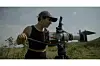 Tunisian filmmaker In\u00e8s Arsi is filming with a long-lens camera in nature, wearing a black crop top and a cap that reads 'Africa Refocused.'