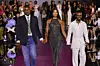 Naomi Campbell taking a final walk on the runway, accompanied by designers Victor Anate (left) and Edvin Thompson (right) for her debut collection for Pretty Little Thing at Cipriani, 25 Broadway on September 05, 2023 in New York City.