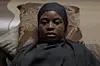 A still from ‘With Difficulty Comes Ease’ showing Chiamaka Anuinoh wearing a black hijab.