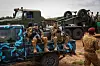 A photo of Burkina Faso's servicemen sitting on a bus.