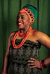 Picutred: Nigerian artist Tosinger as Queen Idia as part of her #We3Queens human art installation project