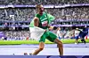 Skander Djamil Athmani of Team Algeria celebrates winning the gold medal with new Paralympic Record after competing in the Paralympic Athletics Men's 100m - T13 Final on day four of the Paris 2024 Summer Paralympic Games at the Stade de France on September 1, 2024 in Paris, France.