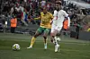Thapelo Morena (L) of South Africa in action against Noussair Mazraoui