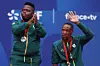 Lucas Sithole and Donald Ramphadi of Team South Africa celebrate with their bronze medal during the Men's Quad Doubles on day seven of the Paris 2024 Summer Paralympic Games at Roland Garros on September 04, 2024 in Paris, France.