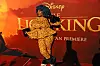 Moonchild Sanelly poses in leopard print top and pants at the South African premiere of 'The Lion King'.