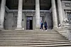 Angela Wachuka and Shiro Koinange stand on the majestic staircase outside the McMillan Memorial Library.
